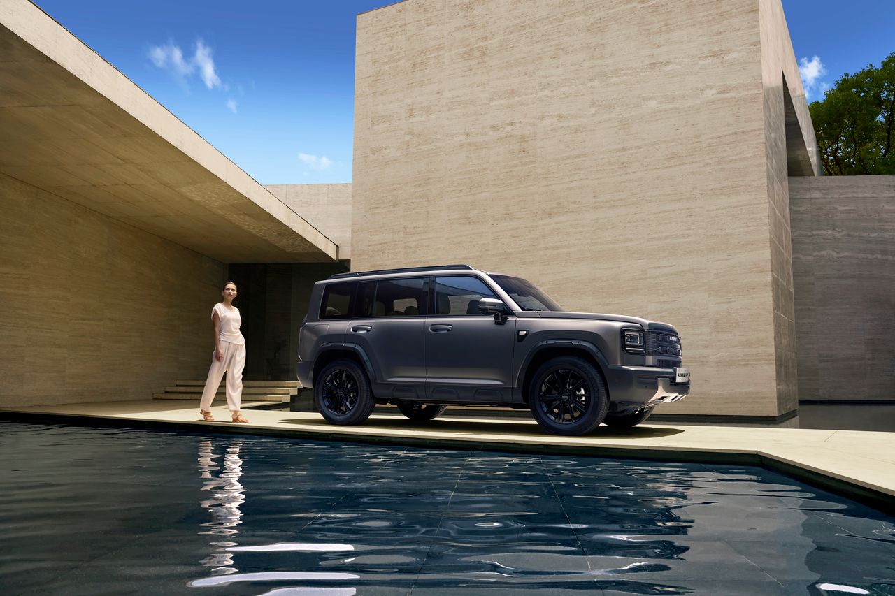 Haval H7 alongside a modern poolside façade